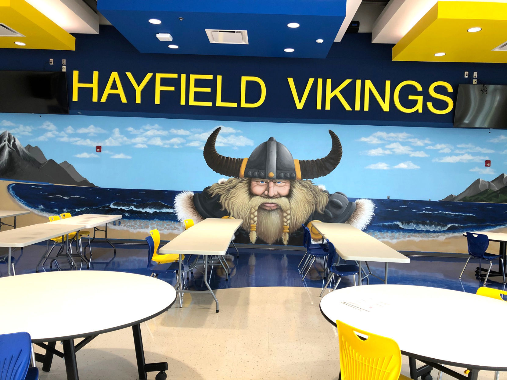 Former student decorates Hayfield High School cafeteria with viking mural